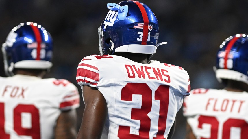 New York Giants safety Gervarrius Owens (31) somehow got a mouth guard stuck into one of the ventilation holes in his helmet during their game against the Detroit Lions in the second quarter at Ford Field