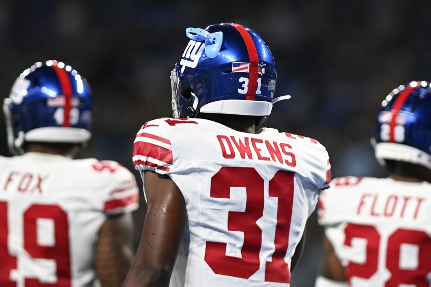 New York Giants safety Gervarrius Owens (31) somehow got a mouth guard stuck into one of the ventilation holes in his helmet during their game against the Detroit Lions in the second quarter at Ford Field