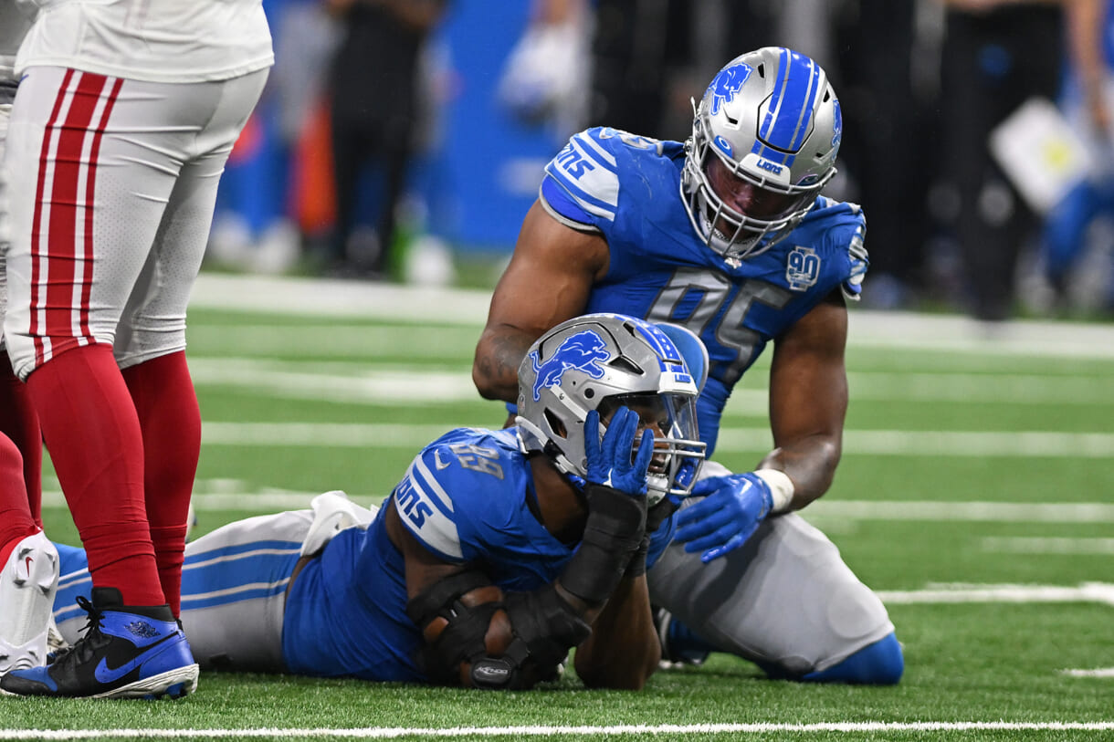 Detroit Lions linebacker Julian Okwara (99) celebrates with linebacker Romeo Okwara (95) after sacking New York Giants quarterback Tommy DeVito (5) (not pictured) in the fourth quarter at Ford Field