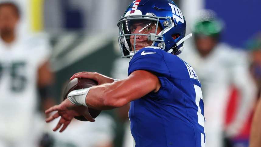 New York Giants quarterback Tommy DeVito (5) throws a pass against the New York Jets during the first half at MetLife Stadium