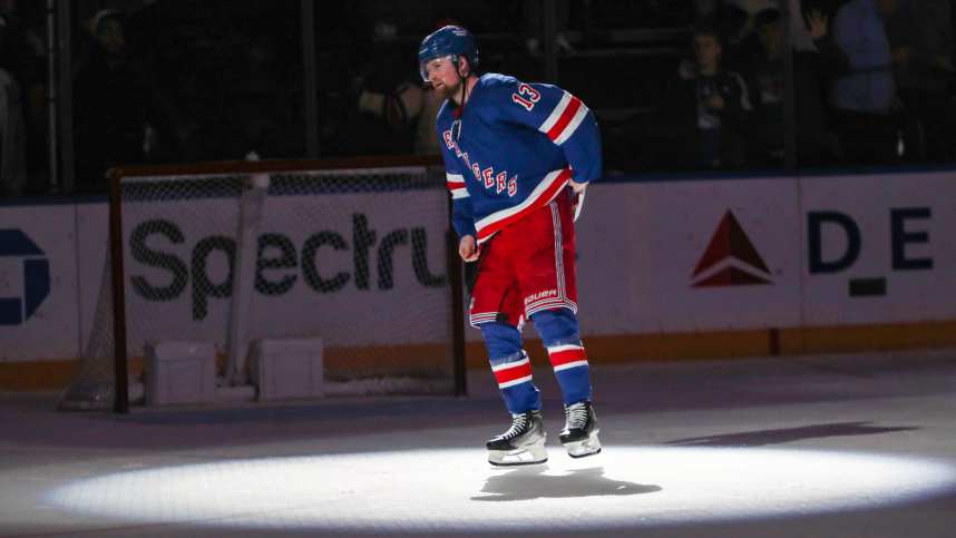 New York Rangers left wing Alexis Lafreniere (13) waves to fans after scoring a game-winning goal in overtime against the Calgary Flames at Madison Square Garden