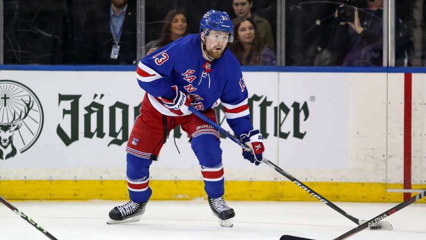 New York Rangers left wing Alexis Lafreniere (13) looks to pass against the Calgary Flames during the third period at Madison Square Garden