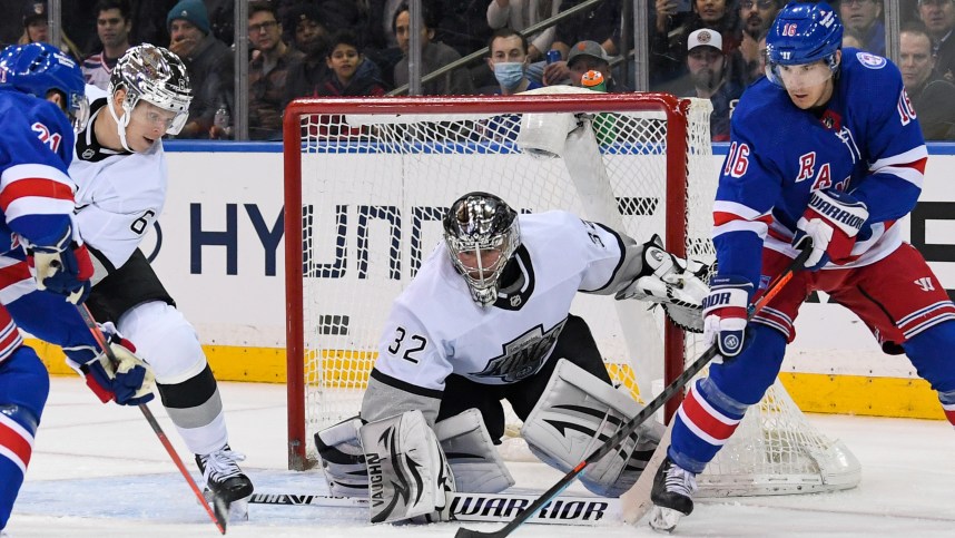 New York Rangers center Ryan Strome (16) plays with the puck in front of Los Angeles Kings goaltender Jonathan Quick (32) during the third period at Madison Square Garden