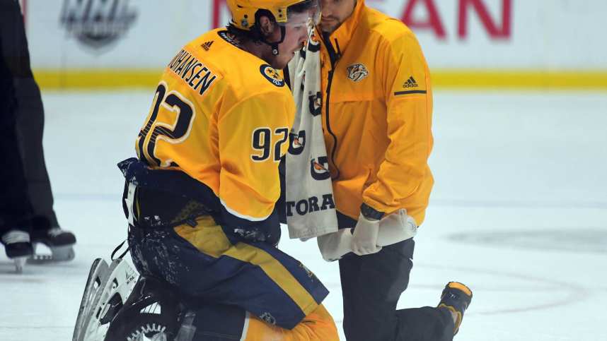 Nashville Predators center Ryan Johansen (92) is looked at by trainer Andy Hosler (New York Rangers) after being hit during the second period