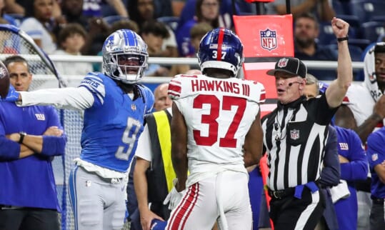 Detroit Lions wide receiver Jameson Williams (9) reacts to a first down catch against New York Giants cornerback Tre Hawkins III (37) during the first half of a preseason game at Ford Field in Detroit on Friday