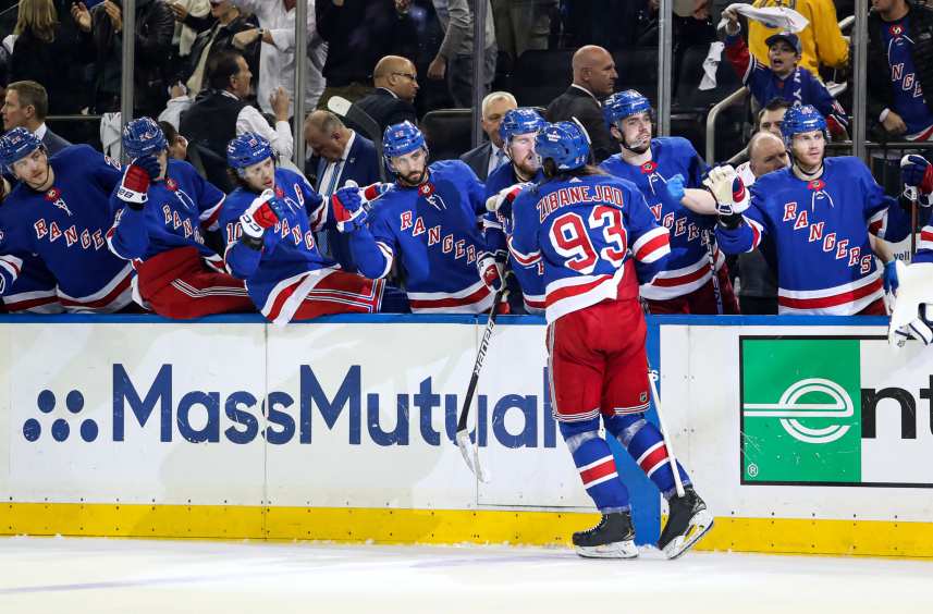 New York Rangers center Mika Zibanejad (93) celebrates with teammates after scoring a goal against the New Jersey Devils during the second period in game six of the first round of the 2023 Stanley Cup Playoffs at Madison Square Garden
