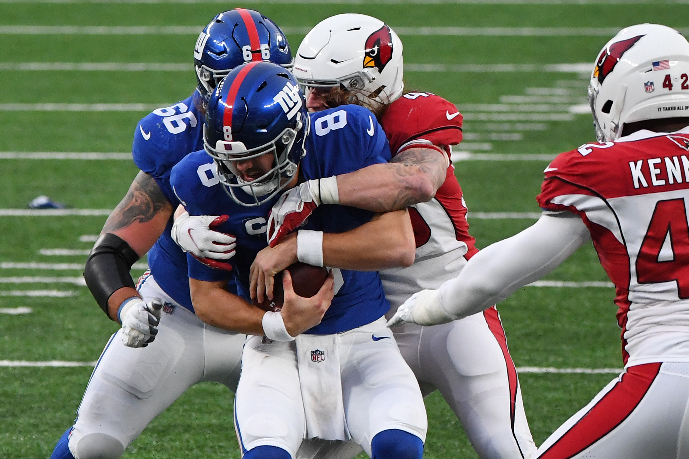 New York Giants quarterback Daniel Jones (8) is sacked by Arizona Cardinals linebacker Dennis Gardeck (45) during the second half at MetLife Stadium