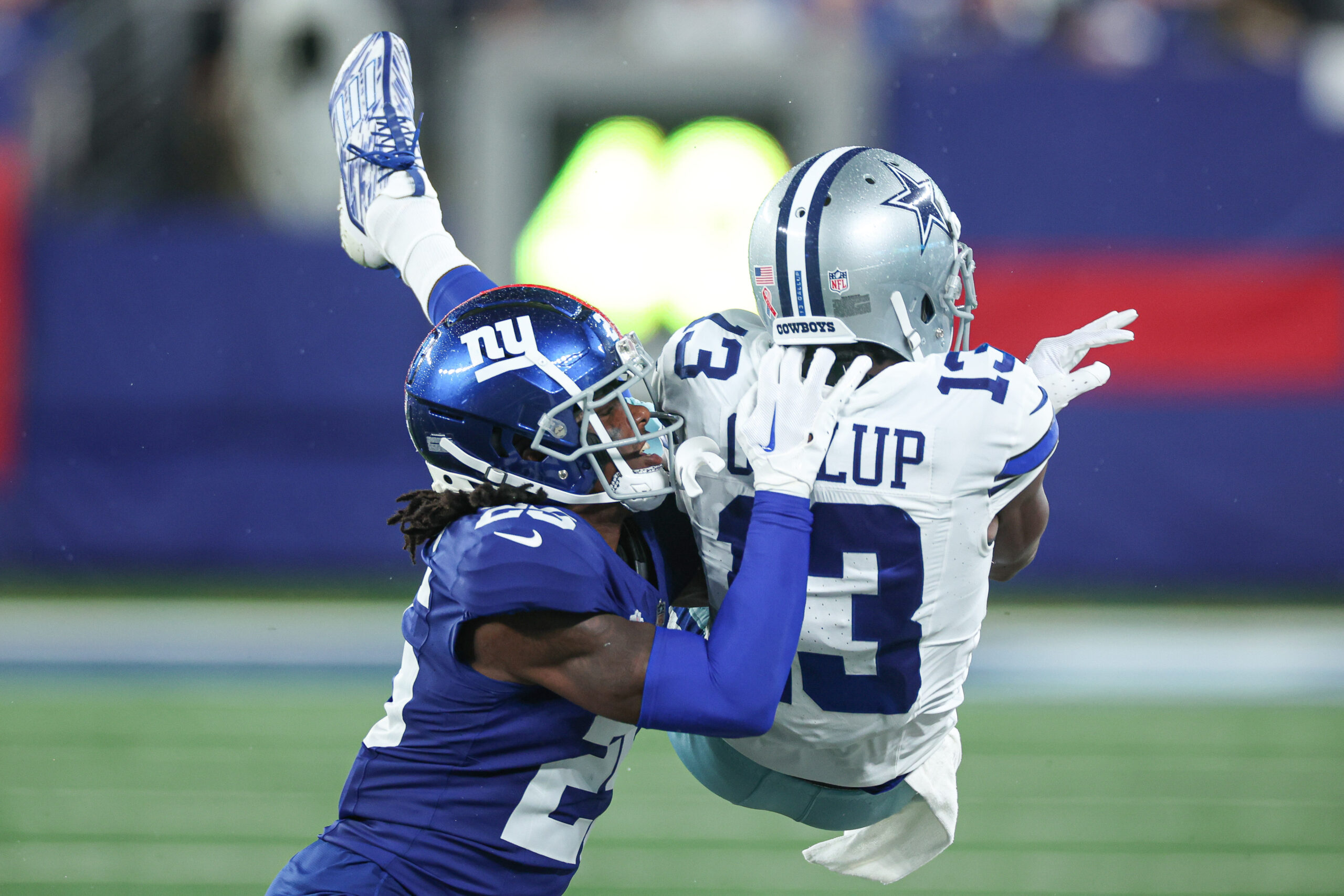 New York Giants cornerback Deonte Banks (25) breaks up a pass intended for Dallas Cowboys wide receiver Michael Gallup (13) during the first half at MetLife Stadium