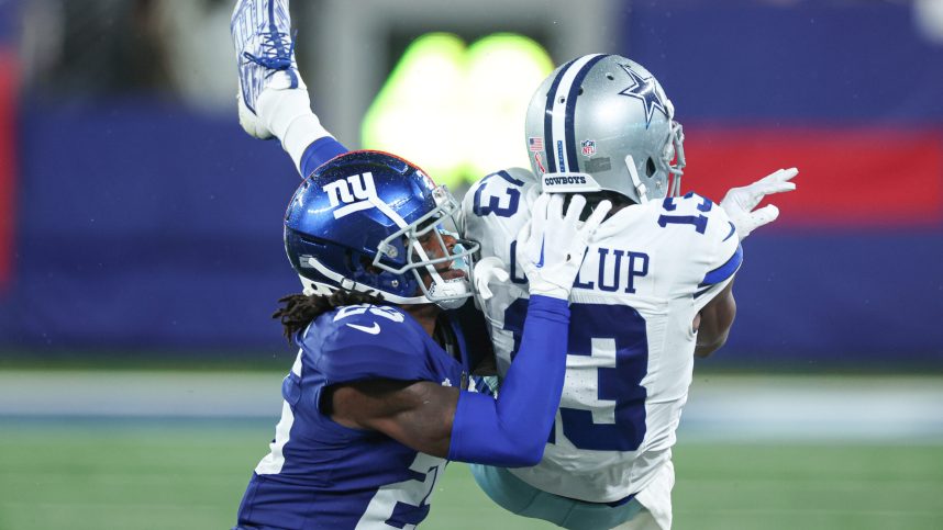 New York Giants cornerback Deonte Banks (25) breaks up a pass intended for Dallas Cowboys wide receiver Michael Gallup (13) during the first half at MetLife Stadium