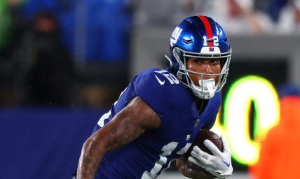 New York Giants tight end Darren Waller (12) runs with the ball against the Dallas Cowboys during the first half at MetLife Stadium