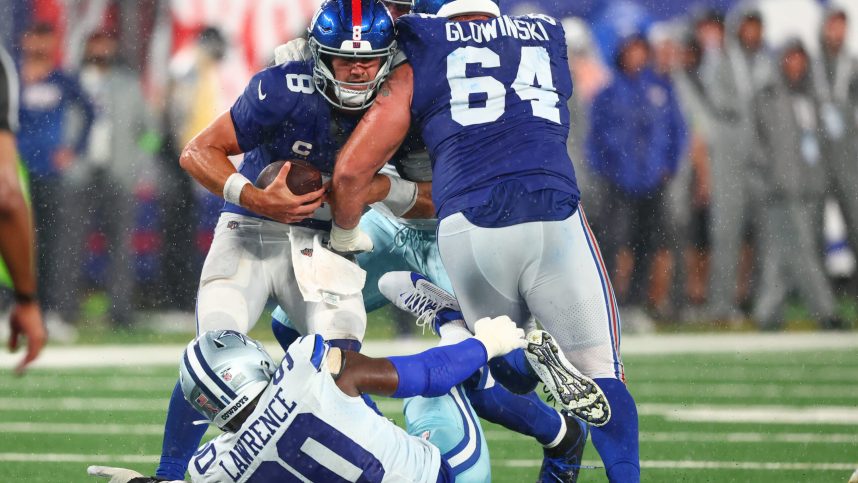 New York Giants quarterback Daniel Jones (8) is sacked by Dallas Cowboys defensive end DeMarcus Lawrence (90) during the second half at MetLife Stadium, Mark Glowinski