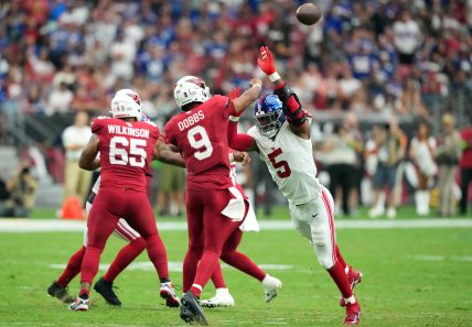 Arizona Cardinals quarterback Joshua Dobbs (9) is pressured by New York Giants linebacker Kayvon Thibodeaux (5) as he throws during the second half at State Farm Stadium