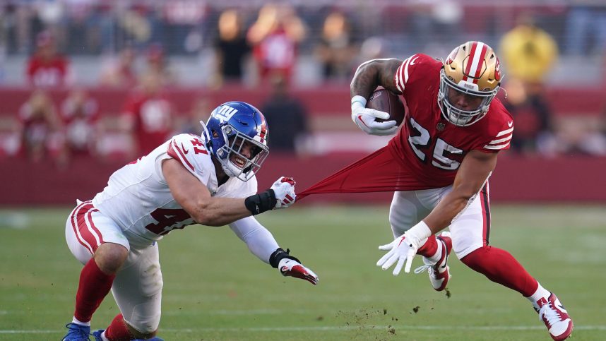San Francisco 49ers running back Elijah Mitchell (25) is tackled by New York Giants linebacker Micah McFadden (41) in the second quarter at Levi's Stadium