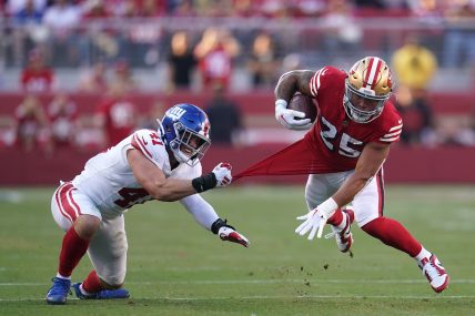 San Francisco 49ers running back Elijah Mitchell (25) is tackled by New York Giants linebacker Micah McFadden (41) in the second quarter at Levi's Stadium