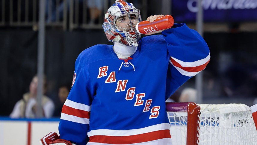 New York Rangers goaltender Dylan Garand (98) drinks water during a game against the New York Islanders at Madison Square Garden