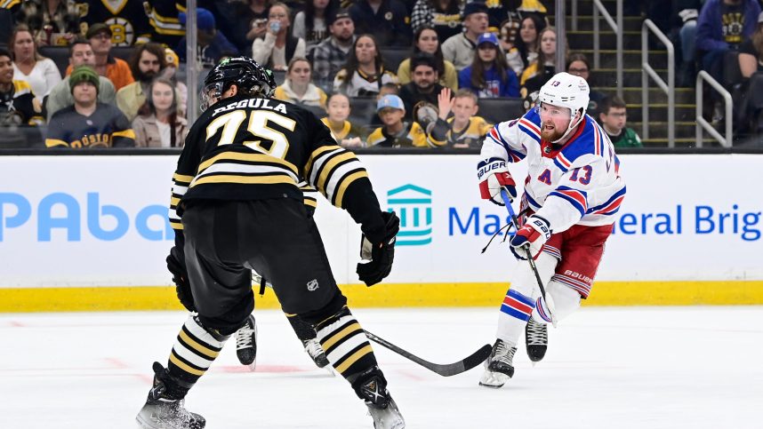 New York Rangers left wing Alexis Lafreniere (13) shoots the puck against the Boston Bruins during the second period at TD Garden