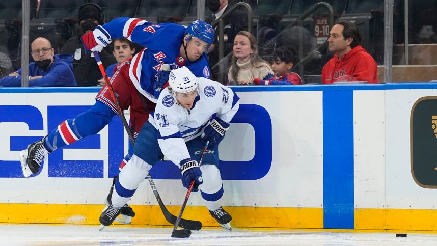 Tampa Bay Lightning center Brayden Point (21) and New York Rangers defenseman Matthew Robertson (44) chase the puck during the third period at Madison Square Garden