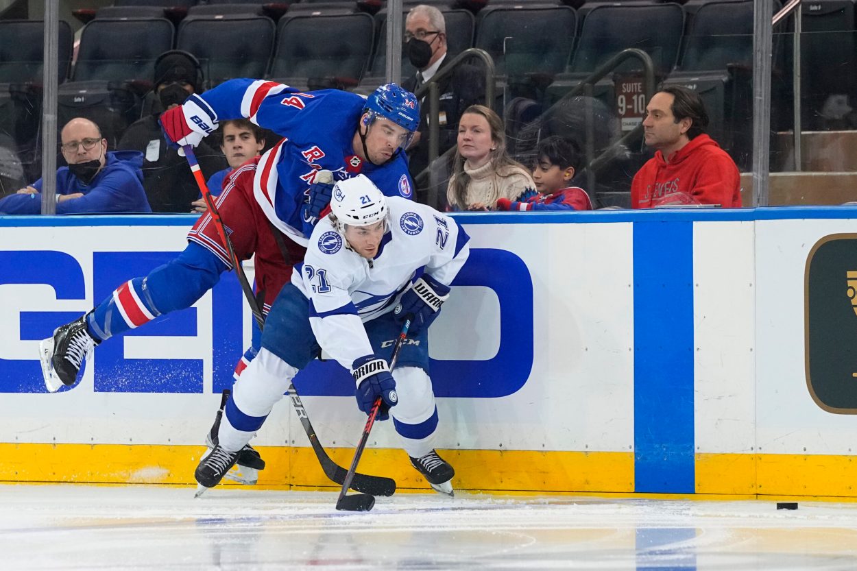 Tampa Bay Lightning center Brayden Point (21) and New York Rangers defenseman Matthew Robertson (44) chase the puck during the third period at Madison Square Garden