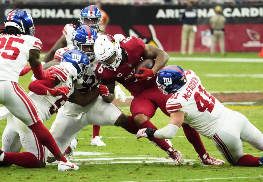 Arizona Cardinals running back James Conner (6) is tackled by New York Giants linebacker Micah McFadden (41) in the fourth quarter at State Farm Stadium in Glendale