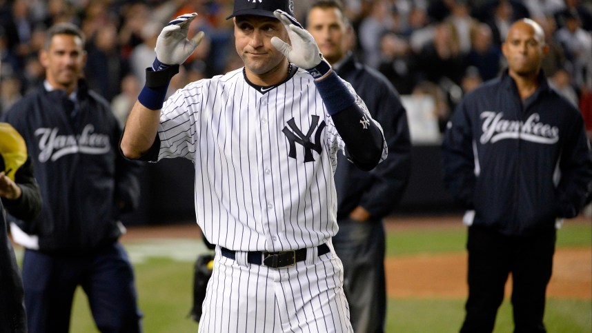 New York Yankees shortstop Derek Jeter (2) reacts with Jorge Posada, Andy Pettitte, and Mariano Rivera after defeating the Baltimore Orioles at Yankee Stadium