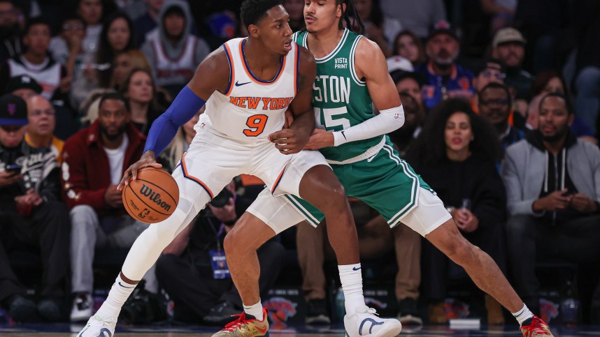 New York Knicks guard RJ Barrett (9) dribbles as Boston Celtics guard Dalano Banton (45) defends during the first quarter at Madison Square Garden