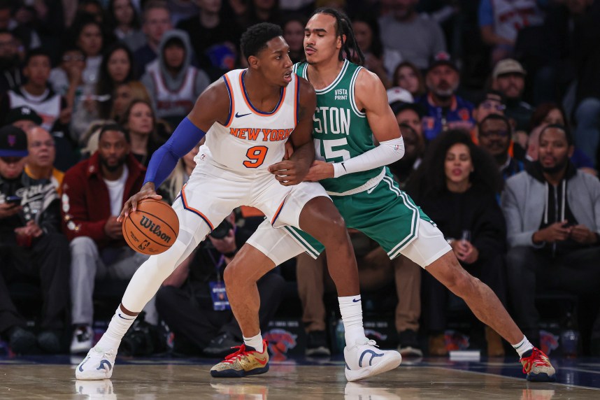 New York Knicks guard RJ Barrett (9) dribbles as Boston Celtics guard Dalano Banton (45) defends during the first quarter at Madison Square Garden