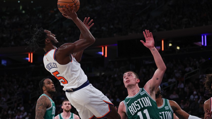 New York Knicks guard Immanuel Quickley (5) shoots the ball as Boston Celtics guard Payton Pritchard (11) defends during the second half at Madison Square Garden