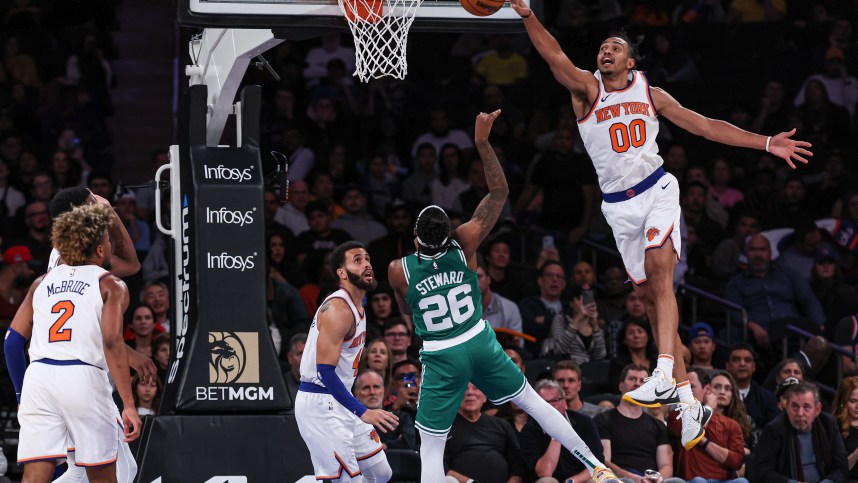 New York Knicks forward Jacob Toppin (00) blocks a shot by Boston Celtics guard DJ Steward (26) during the second half at Madison Square Garden