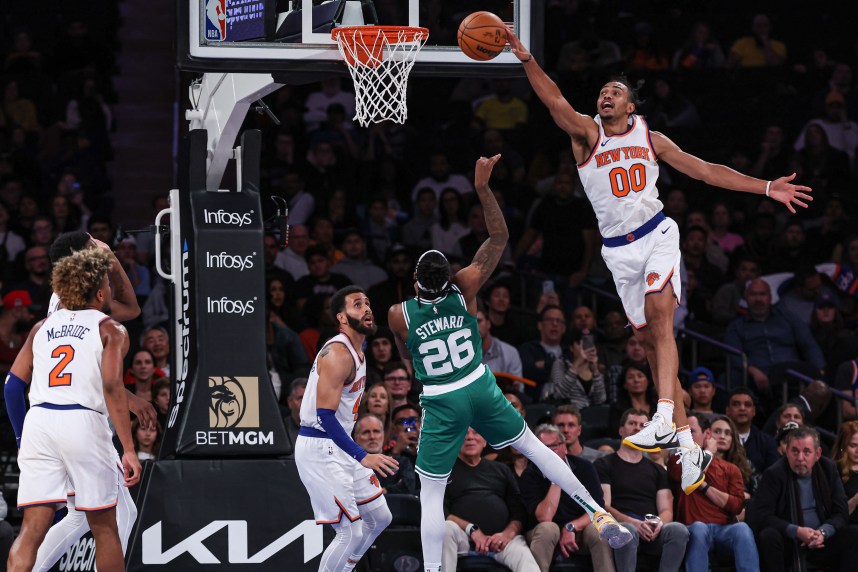 New York Knicks forward Jacob Toppin (00) blocks a shot by Boston Celtics guard DJ Steward (26) during the second half at Madison Square Garden