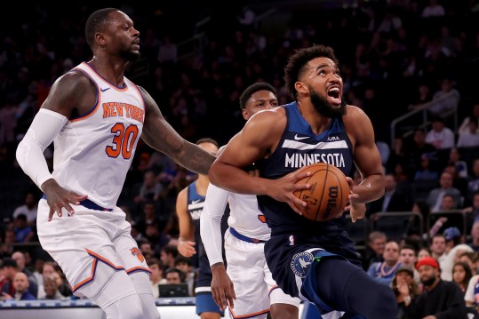 Minnesota Timberwolves center Karl-Anthony Towns (32) drives to the basket against New York Knicks forward Julius Randle (30) and guard RJ Barrett (9) during the first quarter at Madison Square Garden