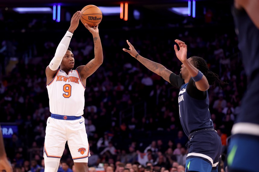 New York Knicks guard RJ Barrett (9) takes a shot against Minnesota Timberwolves center Naz Reid (11) during the third quarter at Madison Square Garden