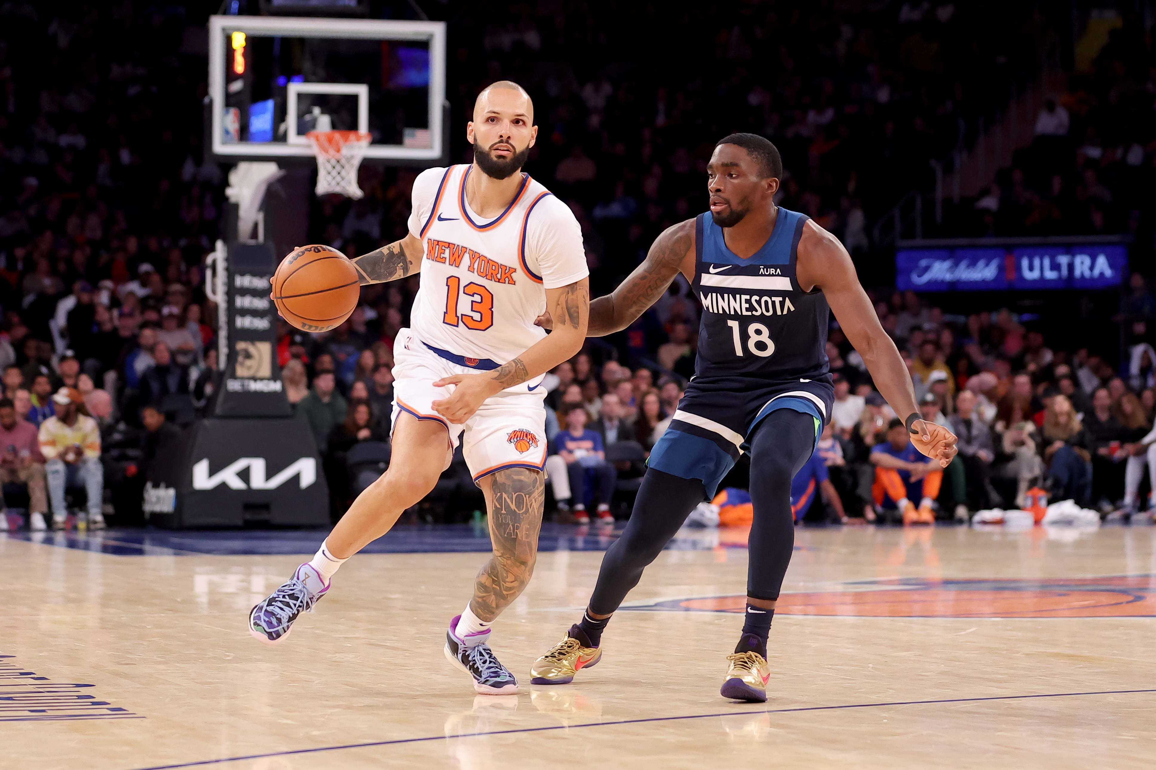 New York Knicks guard Evan Fournier (13) brings the ball up court against Minnesota Timberwolves guard Shake Milton (18) during the fourth quarter at Madison Square Garden