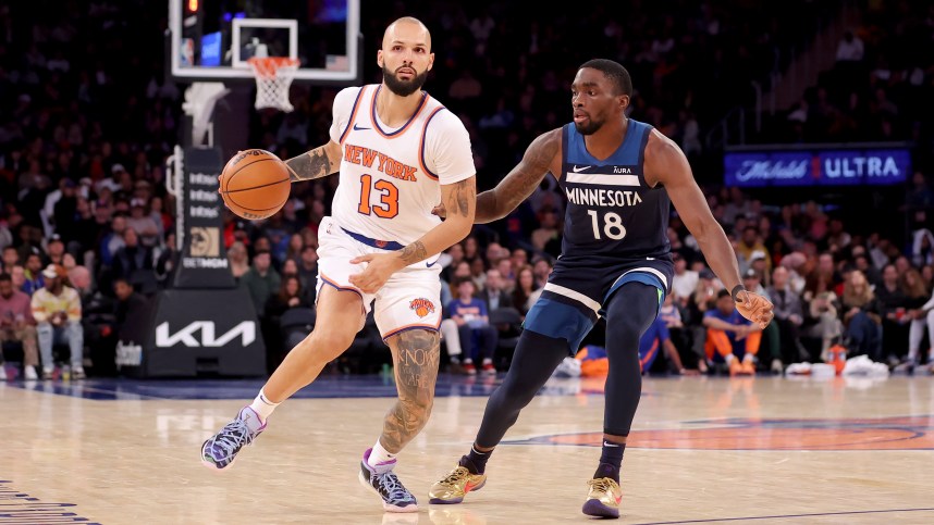 New York Knicks guard Evan Fournier (13) brings the ball up court against Minnesota Timberwolves guard Shake Milton (18) during the fourth quarter at Madison Square Garden