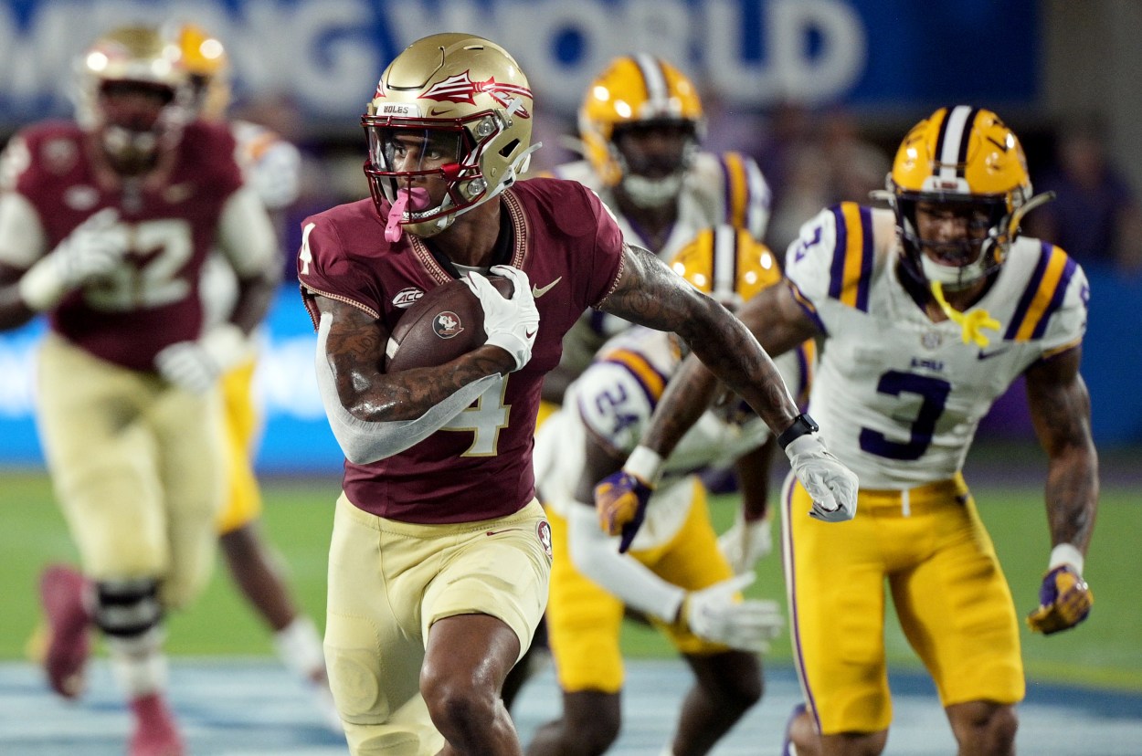 Florida State Seminoles wide receiver Keon Coleman (4) runs the ball for a touchdown during the first half against the Louisiana State Tigers at Camping World Stadium (Giants prospect)