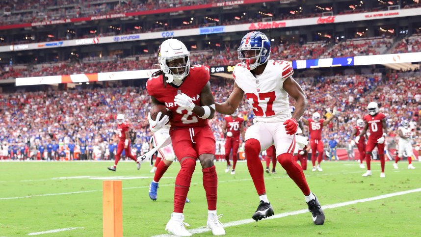 Arizona Cardinals wide receiver Marquise Brown (2) catches a touchdown pass against New York Giants cornerback Tre Hawkins III (37) during the second half at State Farm Stadium