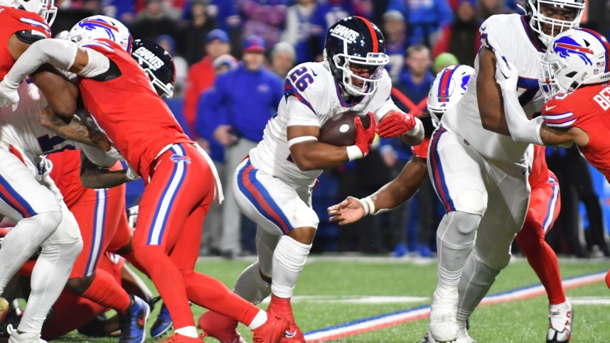 New York Giants running back Saquon Barkley (26) carries the ball against the Buffalo Bills in the second quarter at Highmark Stadium