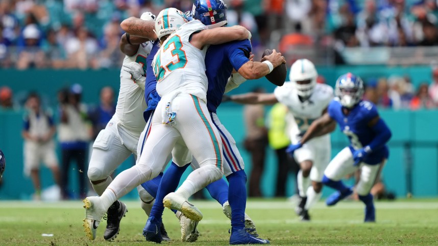 Miami Dolphins linebacker Andrew Van Ginkel (43) sacks Miami Dolphins safety Jevon Holland (8) during the second half at Hard Rock Stadium, New York Giants, Joshua Ezeudu, Daniel Jones
