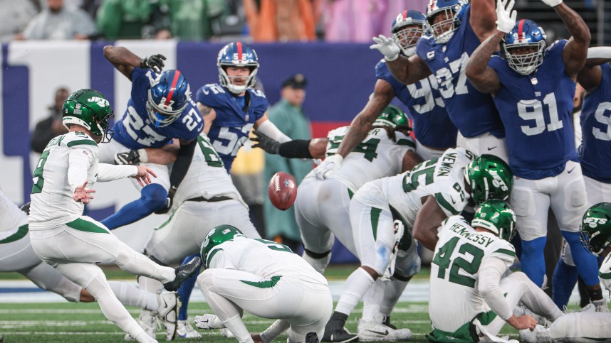 New York Jets place kicker Greg Zuerlein (9) kicks the game winning field goal in overtime against the New York Giants at MetLife Stadium