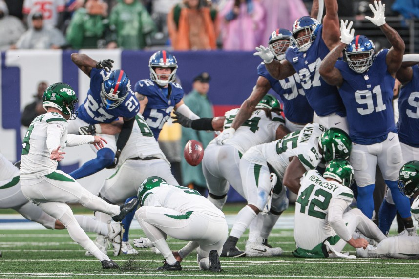 New York Jets place kicker Greg Zuerlein (9) kicks the game winning field goal in overtime against the New York Giants at MetLife Stadium