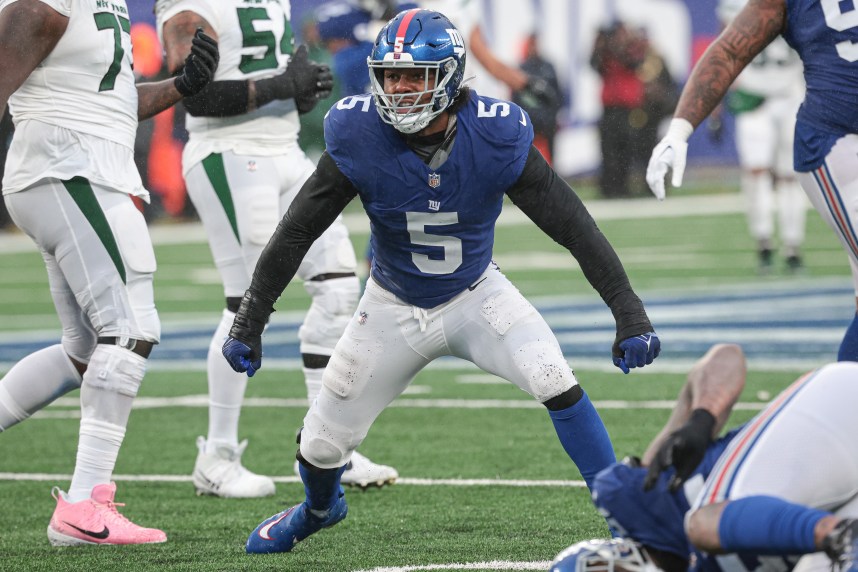 New York Giants linebacker Kayvon Thibodeaux (5) reacts after sacking New York Jets quarterback Zach Wilson (2) during the second half at MetLife Stadium