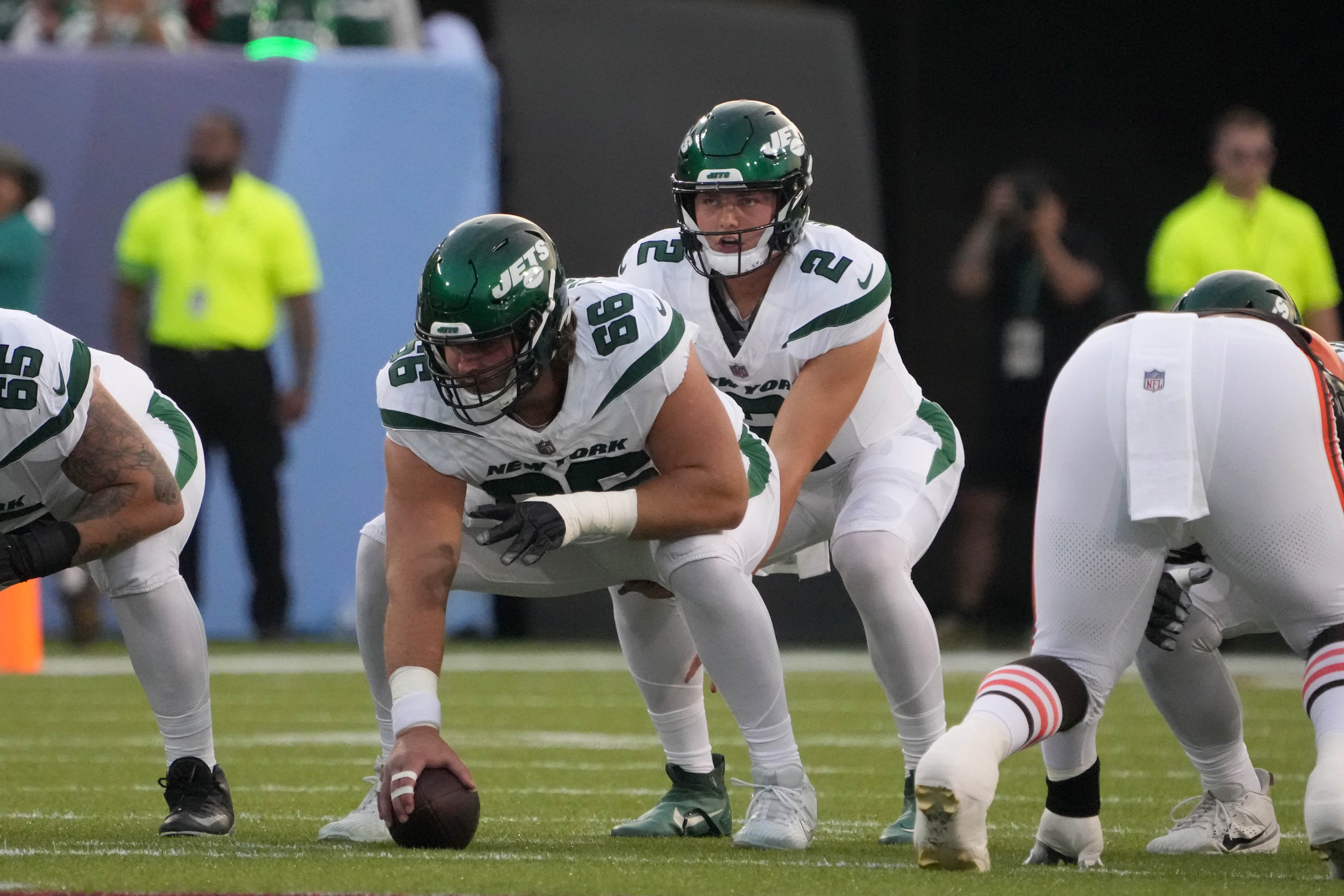 New York Jets quarterback Zach Wilson (2) takes the snap from center Joe Tippmann (66) against the Cleveland Browns during the first half at Tom Benson Hall of Fame Stadium