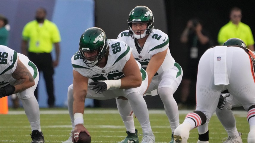 New York Jets quarterback Zach Wilson (2) takes the snap from center Joe Tippmann (66) against the Cleveland Browns during the first half at Tom Benson Hall of Fame Stadium