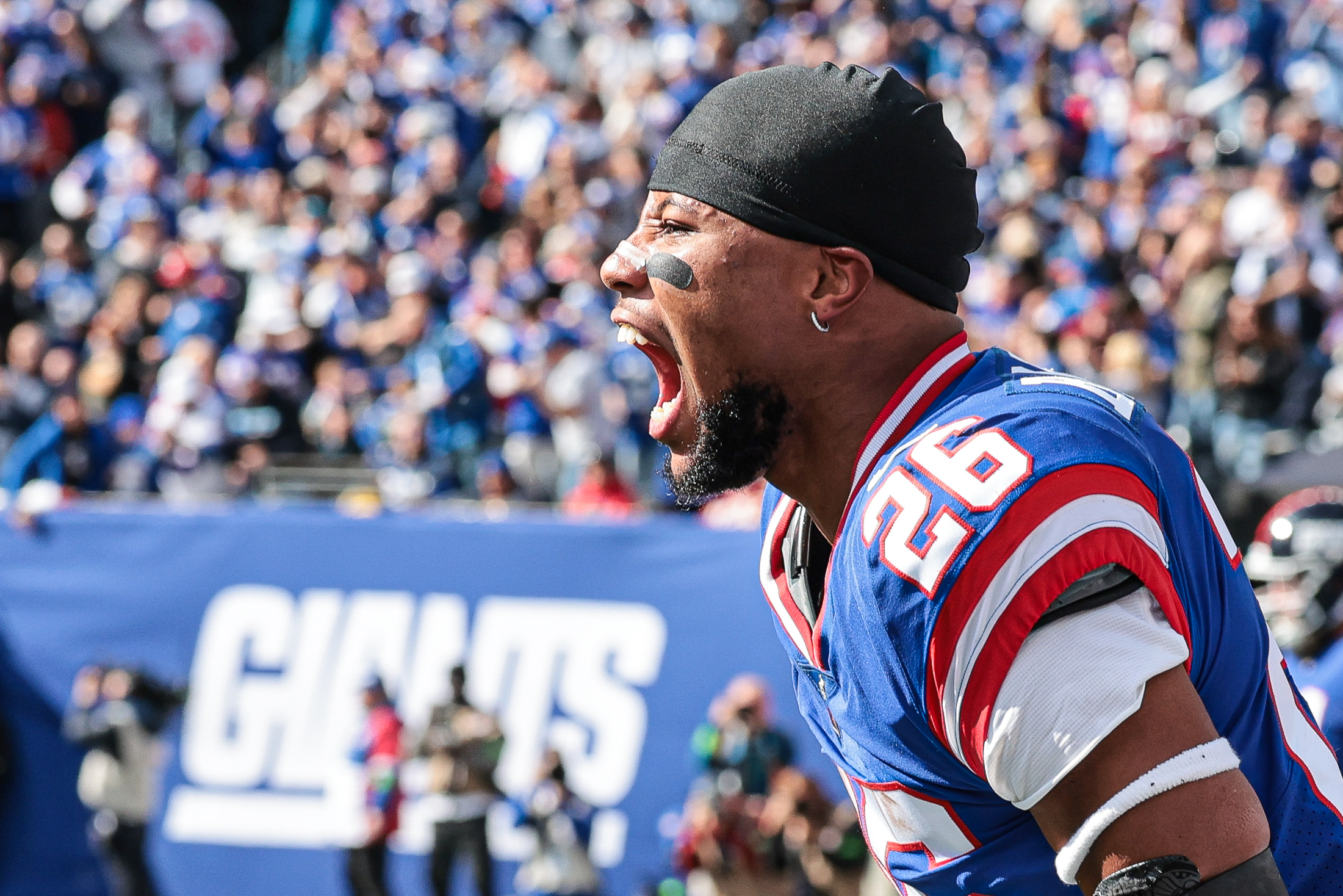 New York Giants running back Saquon Barkley (26) celebrates a Giants touchdown during the first half against the Washington Commanders at MetLife Stadium