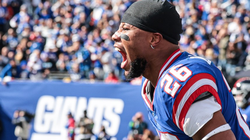 New York Giants running back Saquon Barkley (26) celebrates a Giants touchdown during the first half against the Washington Commanders at MetLife Stadium