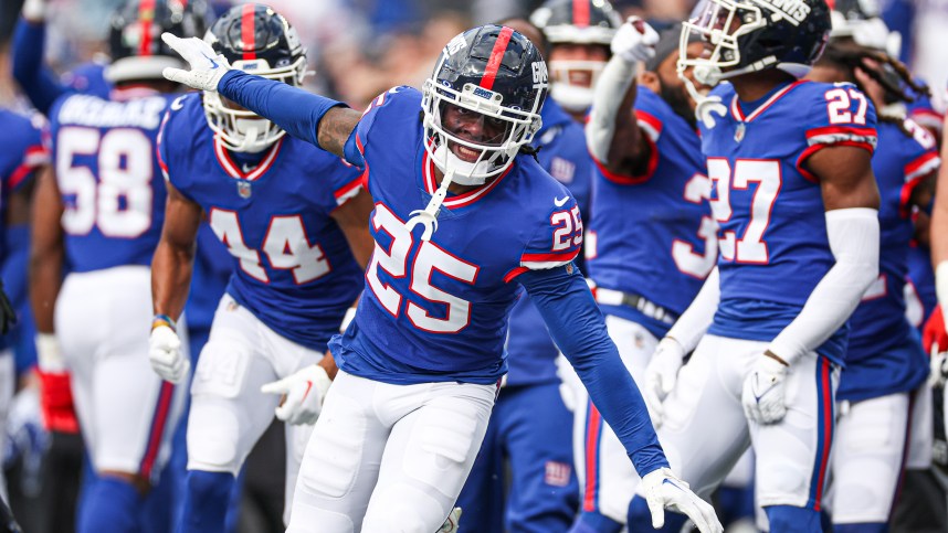 New York Giants cornerback Deonte Banks (25) celebrates after an interception against the Washington Commanders during the first half at MetLife Stadium