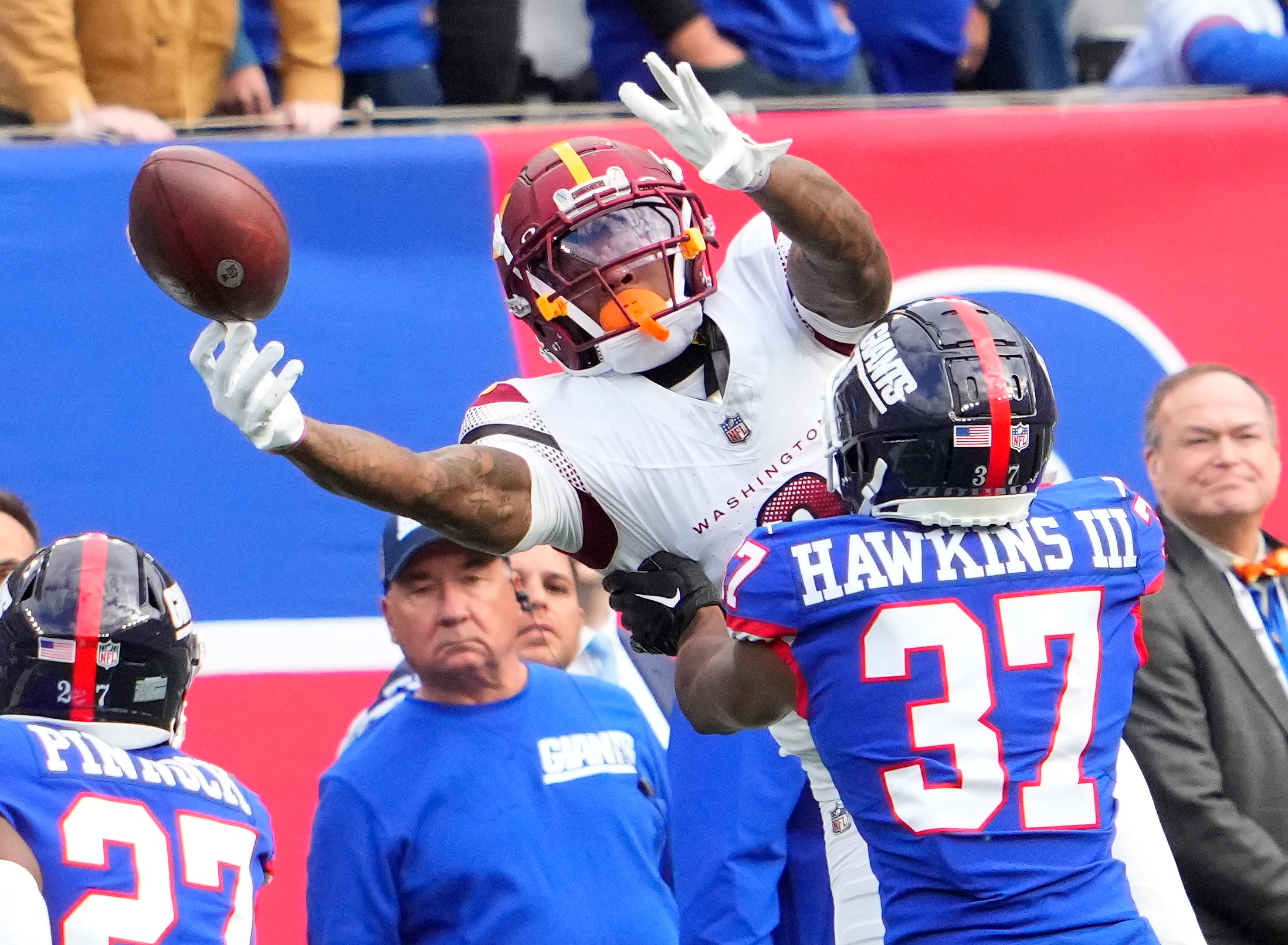 Washington Commanders wide receiver Dyami Brown (2) is unable the catch the ball as New York Giants cornerback Tre Hawkins III (37) defends in the second half at MetLife Stadium