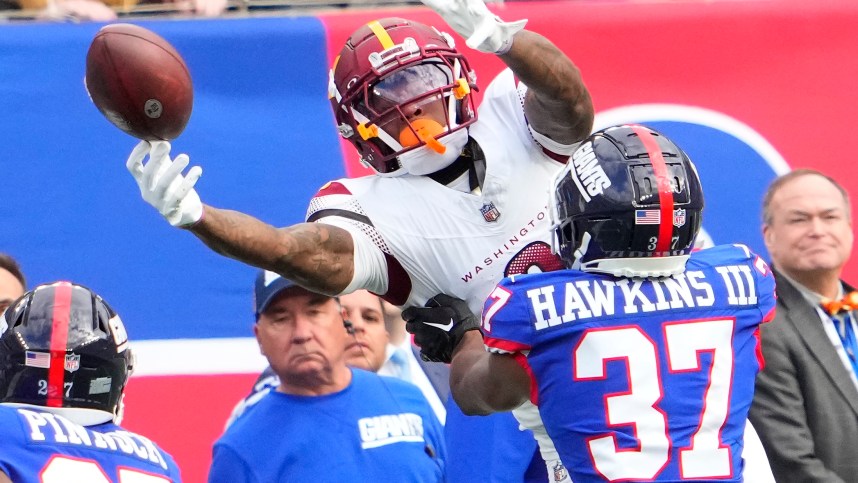 Washington Commanders wide receiver Dyami Brown (2) is unable the catch the ball as New York Giants cornerback Tre Hawkins III (37) defends in the second half at MetLife Stadium