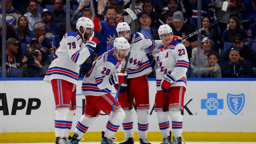 New York Rangers left wing Chris Kreider (20) celebrates his goal with teammates during the third period against the Buffalo Sabres at KeyBank Center