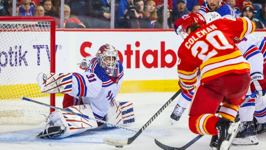New York Rangers goaltender Igor Shesterkin (31) makes a save against Calgary Flames center Blake Coleman (20) during the second period at Scotiabank Saddledome