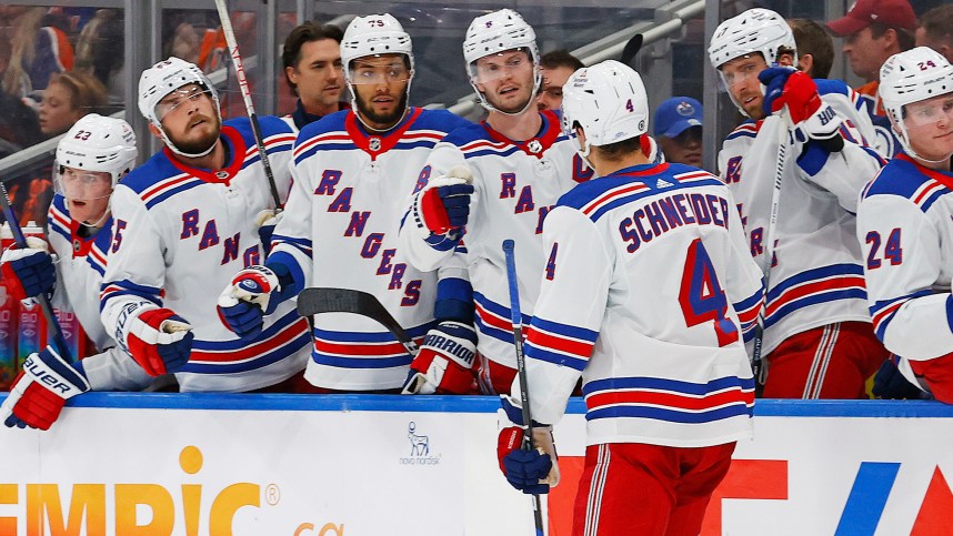 The New York Rangers celebrate a goal scored by defensemen Braden Schneider (4) during the second period against the Edmonton Oilers at Rogers Place